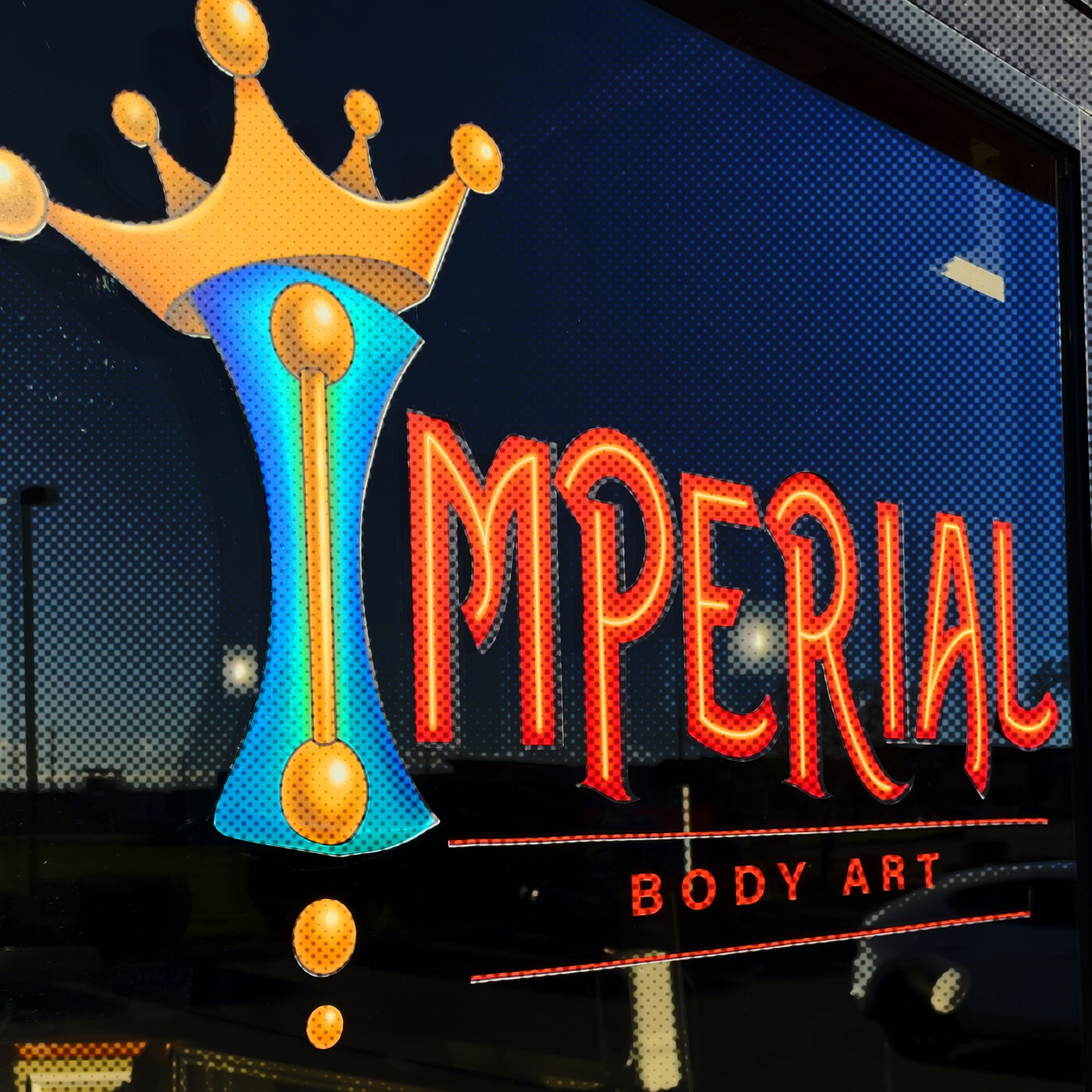 Imperial Body Art logo on the door of the tattoo and piercing shop near Boise, ID